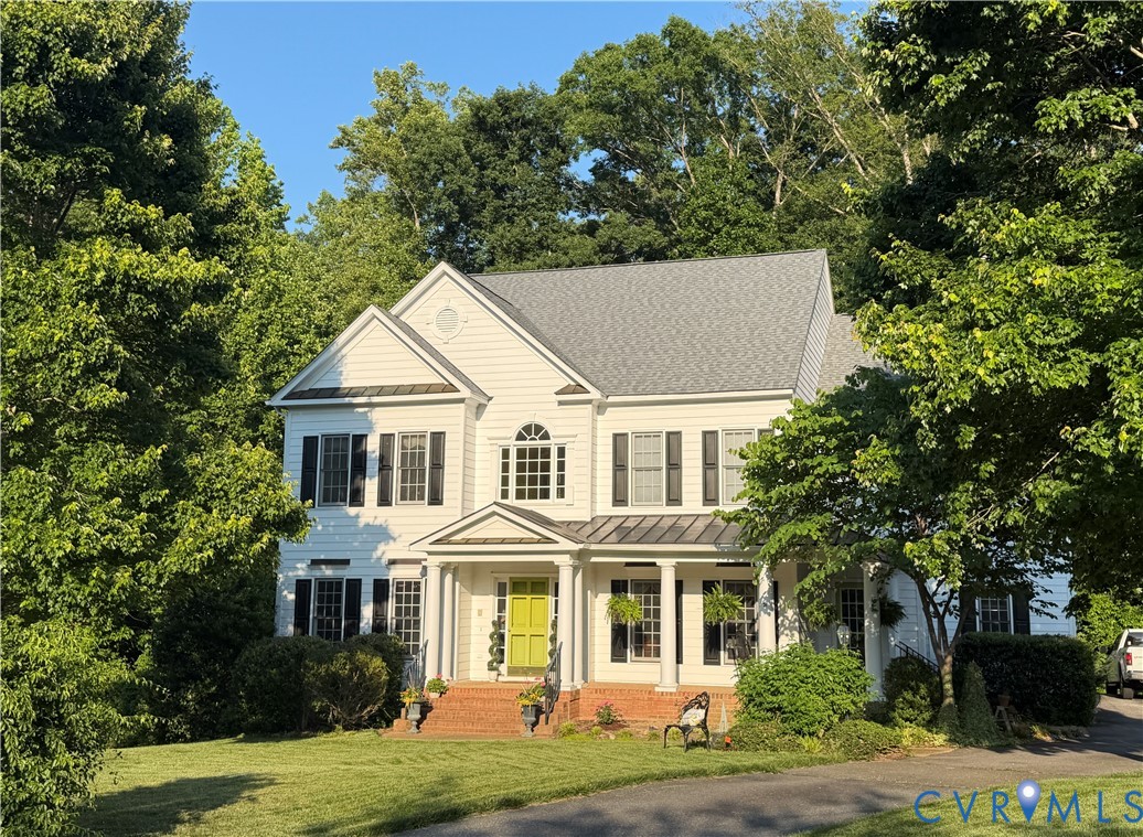 front view of a house with a yard