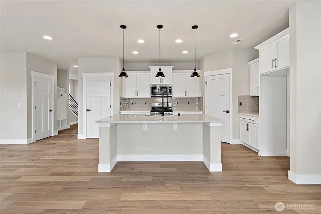 a view of kitchen with wooden floor