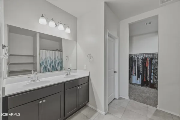 a bathroom with a sink double vanity and a mirror