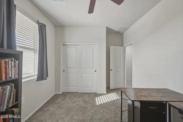 a kitchen with windows and cabinet