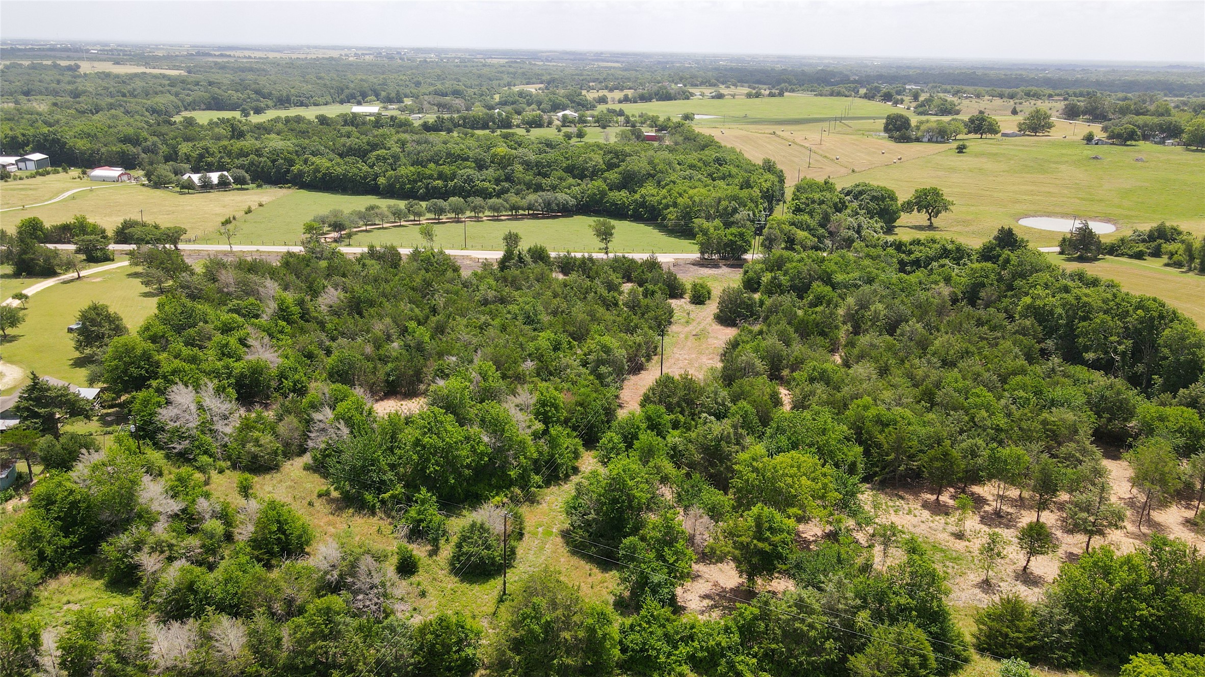 Lot 7 Wonder Hill Road Chappell Hill, TX 77426 - Photo 12 of 13 an aerial view of residential houses with outdoor space and river