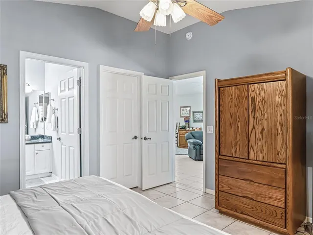 a view of a bedroom with closet and entryway