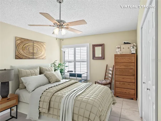 a bedroom with a bed a dresser and a window