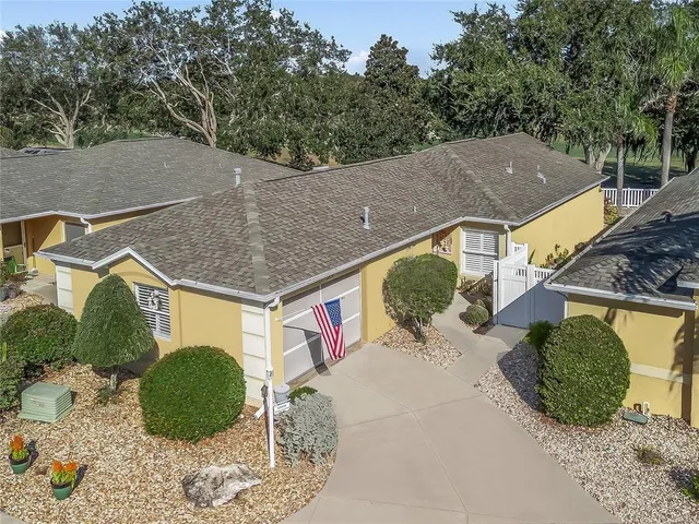 a aerial view of a house with a yard