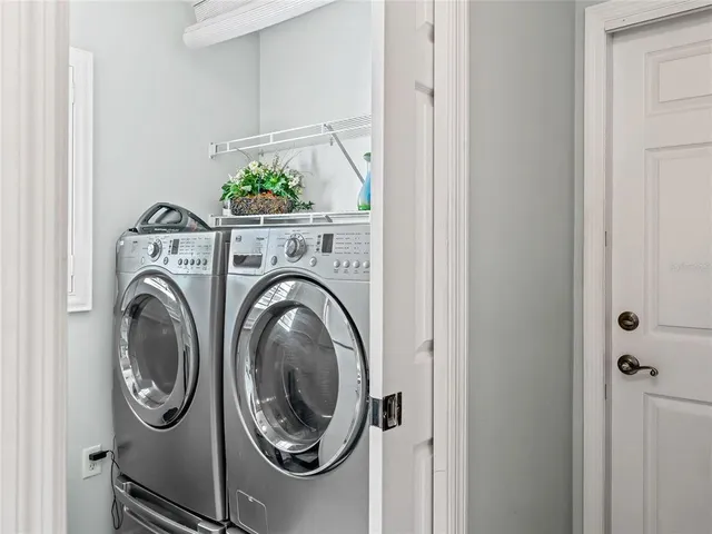 a utility room with dryer and washer