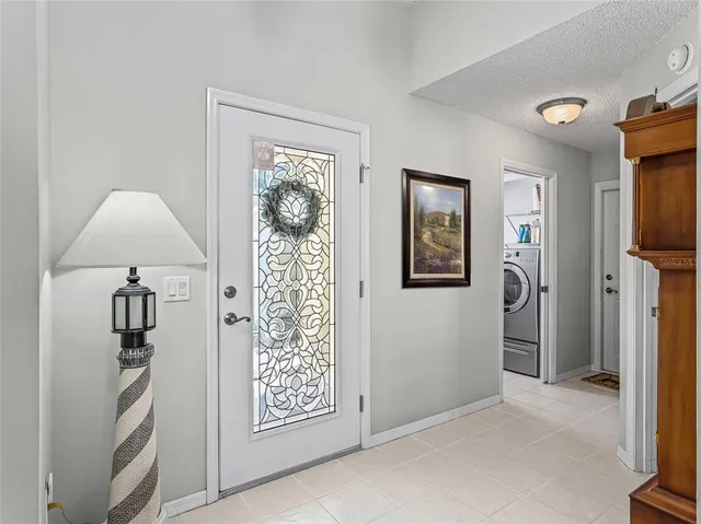 a view of front door with wooden floor