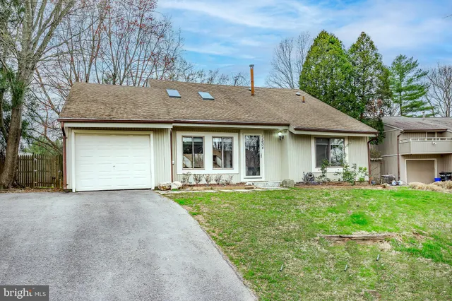 a front view of a house with a garden and porch