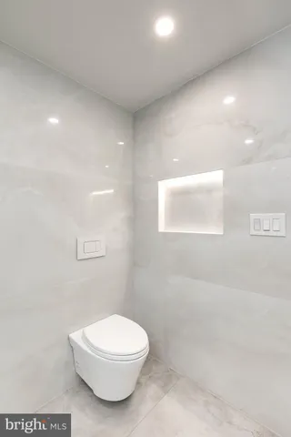 a bathroom with a toilet a sink and a shower