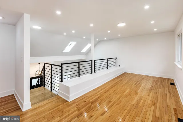 a spacious bedroom with a bed and a table