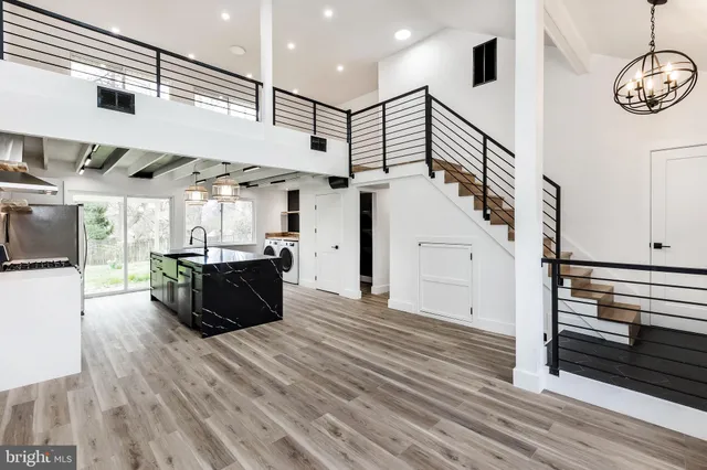 a view of a room with wooden floor
