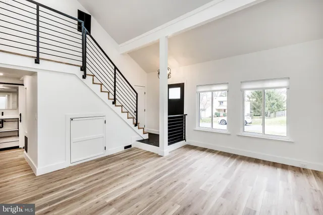 wooden floor in an empty room with a window and wooden floor