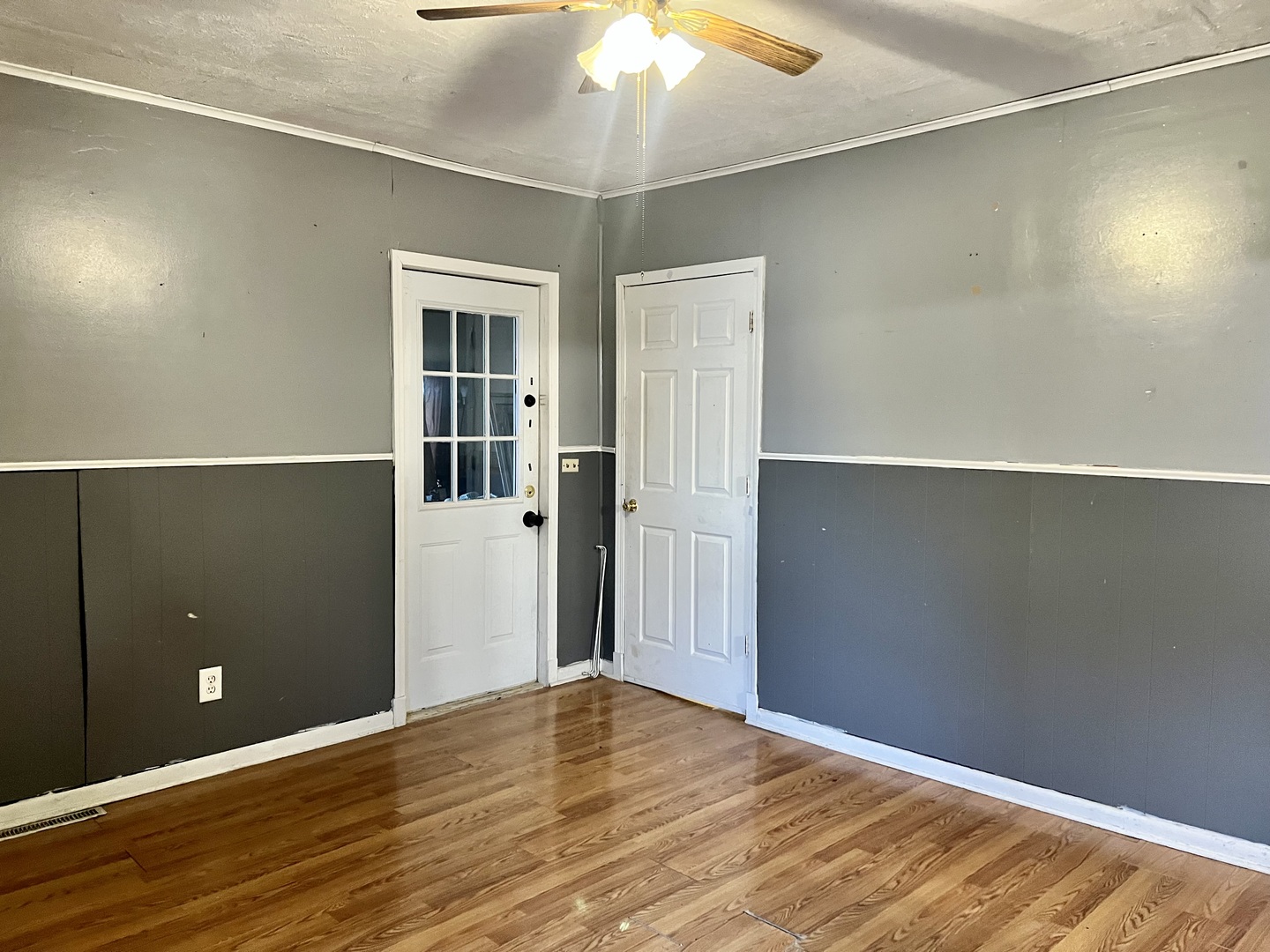 375 West Franklin Street Paxton, IL 60957 - Photo 3 of 43 an empty room with wooden floor and windows