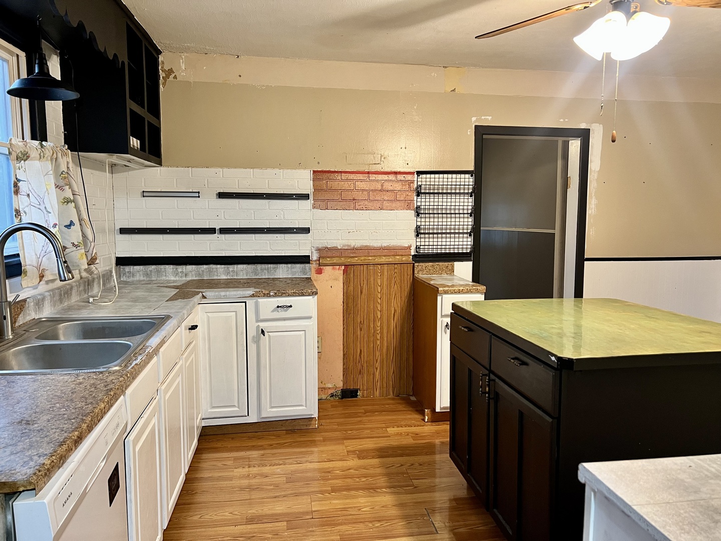 375 West Franklin Street Paxton, IL 60957 - Photo 9 of 43 a kitchen with kitchen island granite countertop a sink and refrigerator