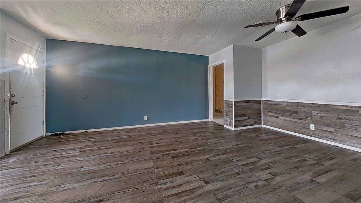 4245 Dody Street Corpus Christi, TX 78411 - Photo 4 of 15 a view of an empty room with wooden floor
