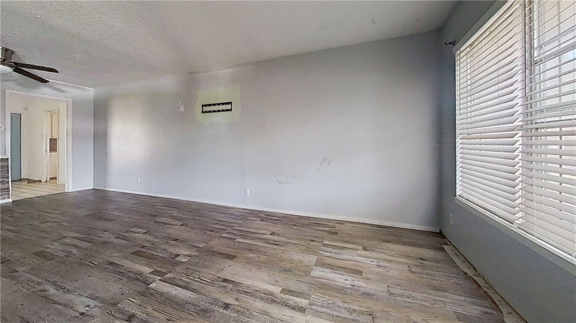 4245 Dody Street Corpus Christi, TX 78411 - Photo 5 of 15 a view of empty room with wooden floor and fan