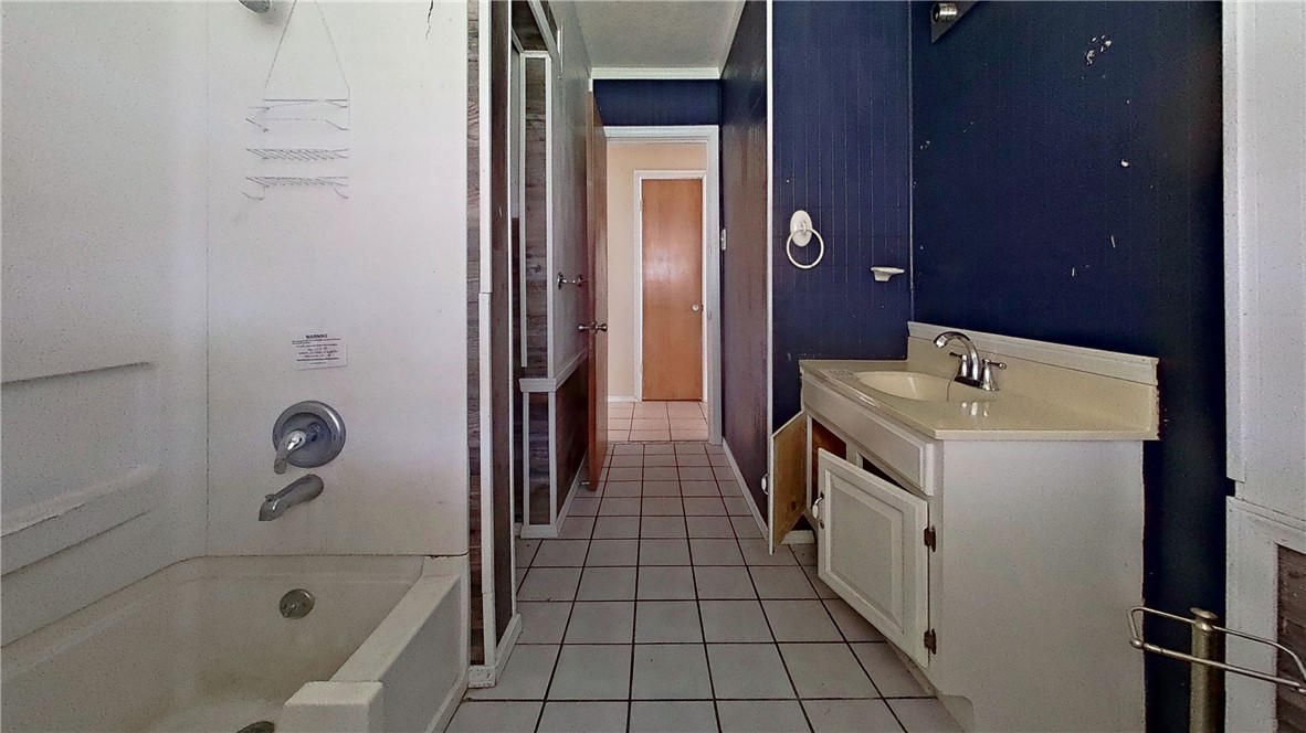 4245 Dody Street Corpus Christi, TX 78411 - Photo 9 of 15 a bathroom with a sink a toilet and shower