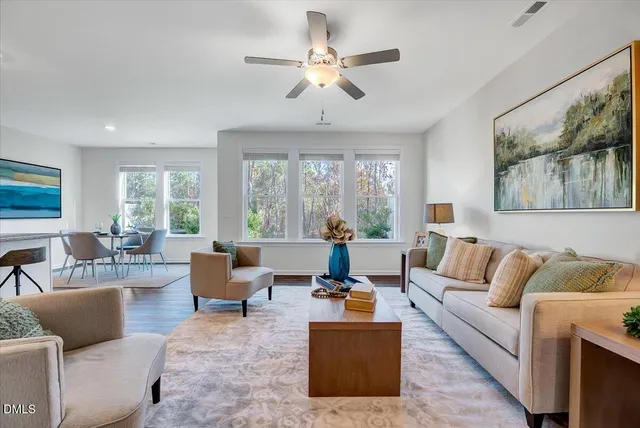 a living room with furniture and a large window