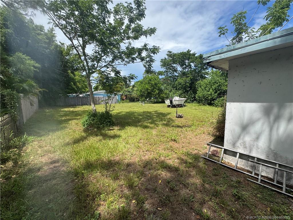 4729 Southeast Compass Way Stuart, FL 34997 - Photo 2 of 2 Left side & back yard. Fire hydrant on site