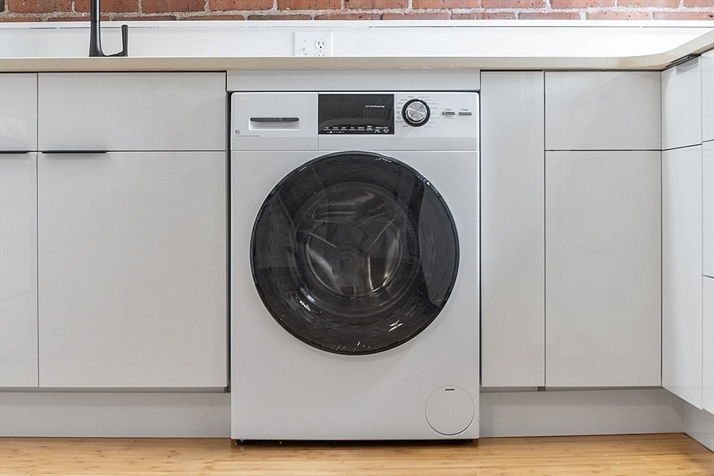 6 Radcliffe Road, Unit B Boston, MA 02134 - Photo 11 of 25 a utility room with dryer and washer