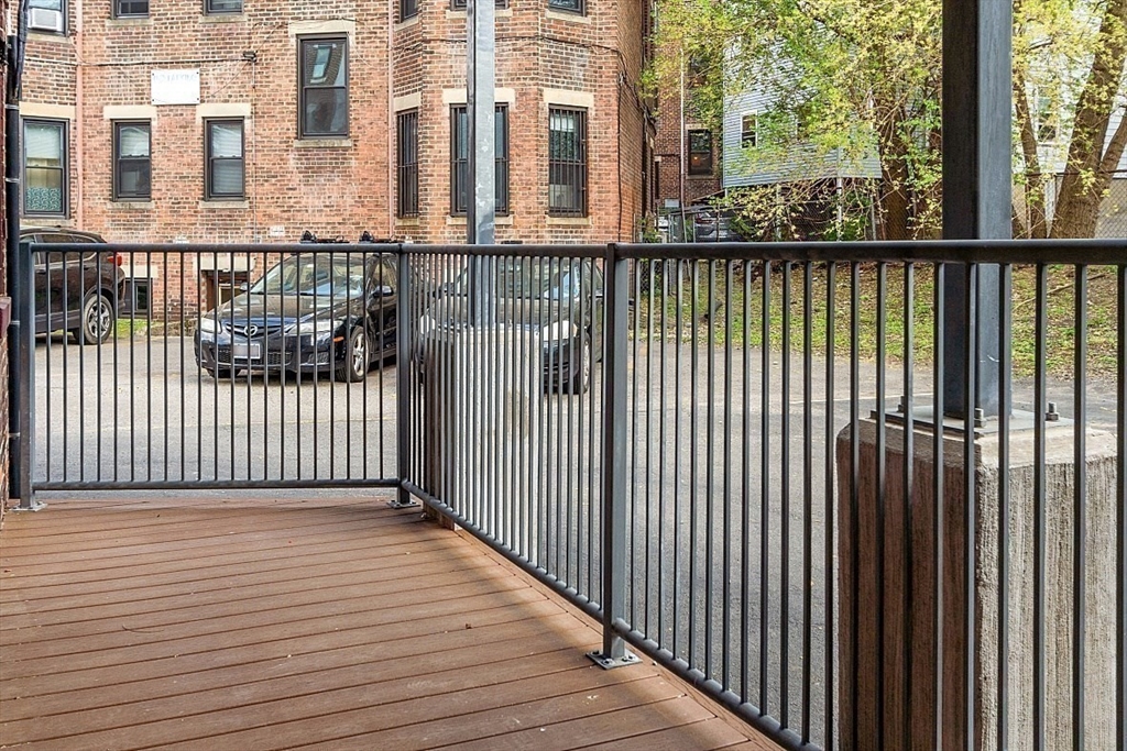 6 Radcliffe Road, Unit B Boston, MA 02134 - Photo 22 of 25 a view of a balcony with wooden floor