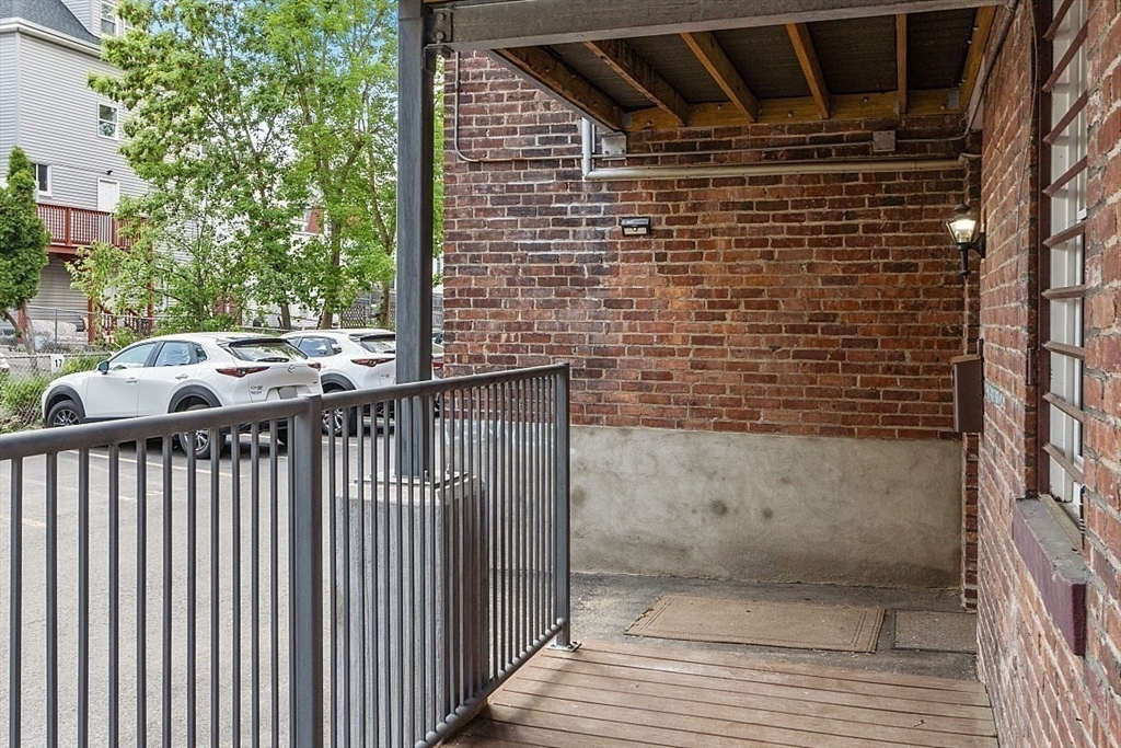 6 Radcliffe Road, Unit B Boston, MA 02134 - Photo 23 of 25 a view of a balcony with an outdoor space