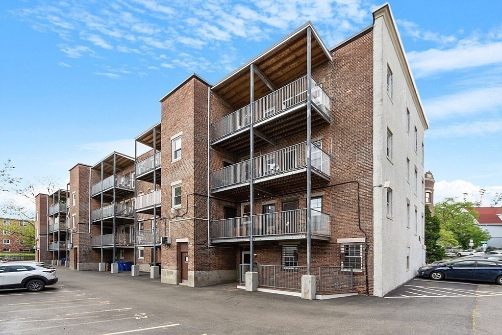 6 Radcliffe Road, Unit B Boston, MA 02134 - Photo 24 of 25 a front view of a building with a street