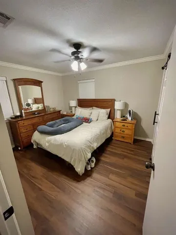 a bedroom with bed and window