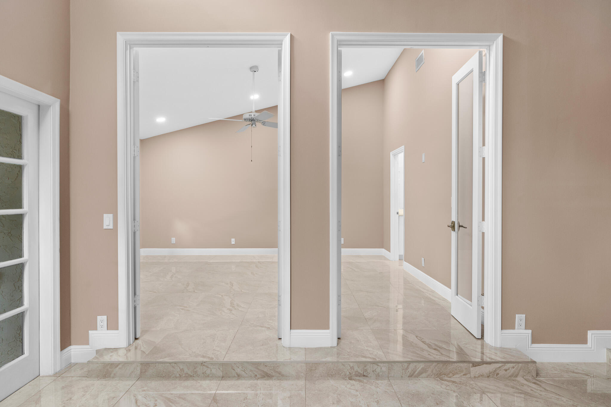 22545 Meridiana Drive Boca Raton, FL 33433 - Photo 19 of 63 an empty room with wooden floor and a bathroom view