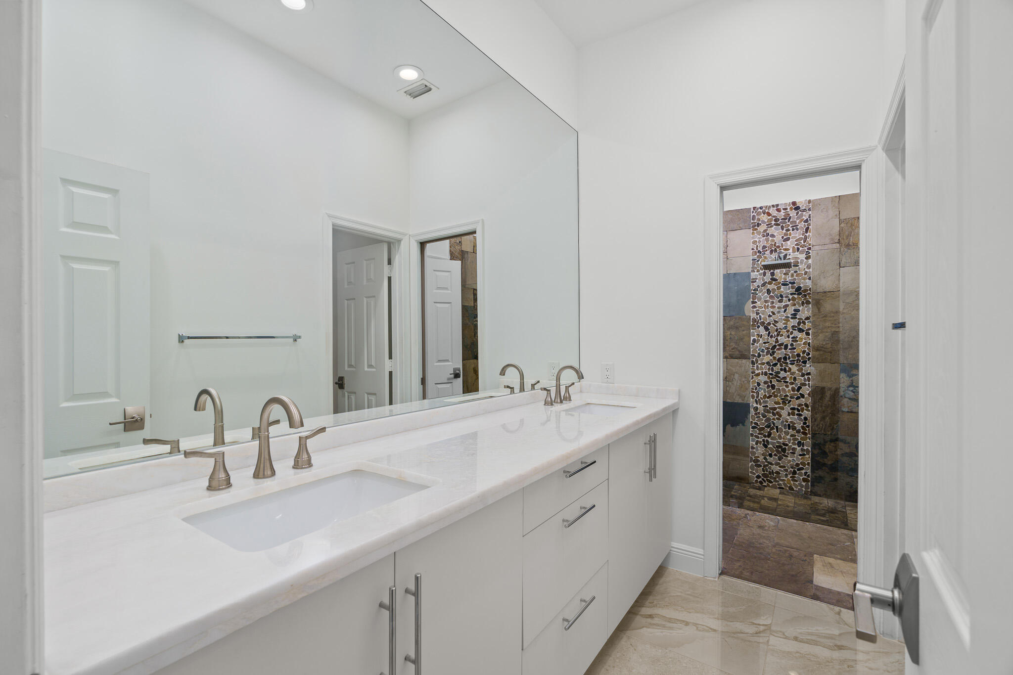 22545 Meridiana Drive Boca Raton, FL 33433 - Photo 27 of 63 a bathroom with a sink double vanity and a shower