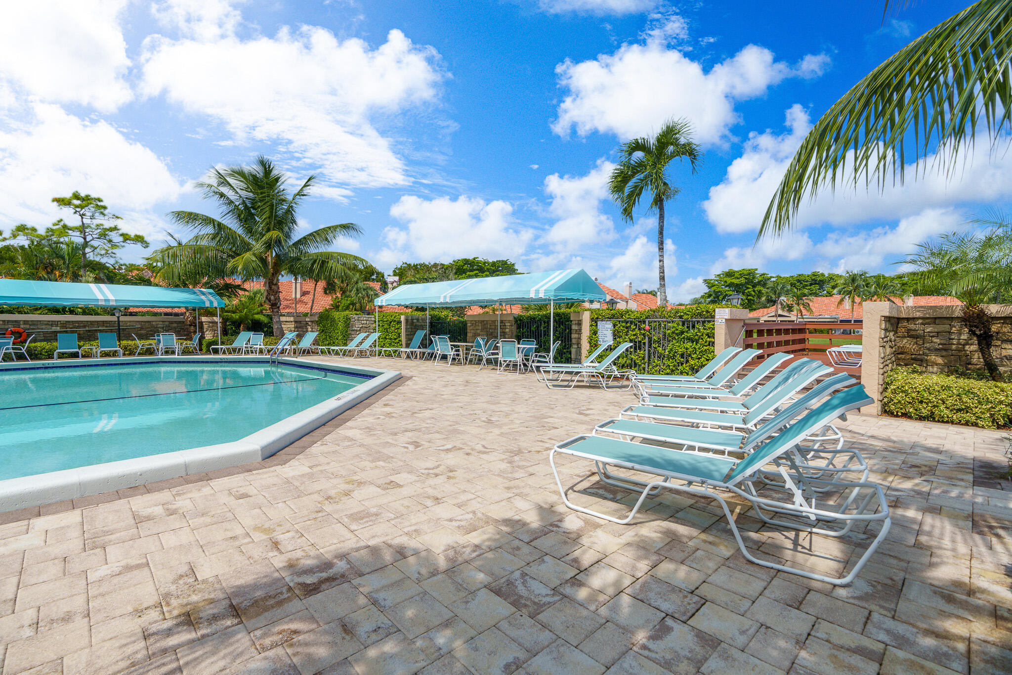 22545 Meridiana Drive Boca Raton, FL 33433 - Photo 41 of 63 a view of a swimming pool with a lounge chair