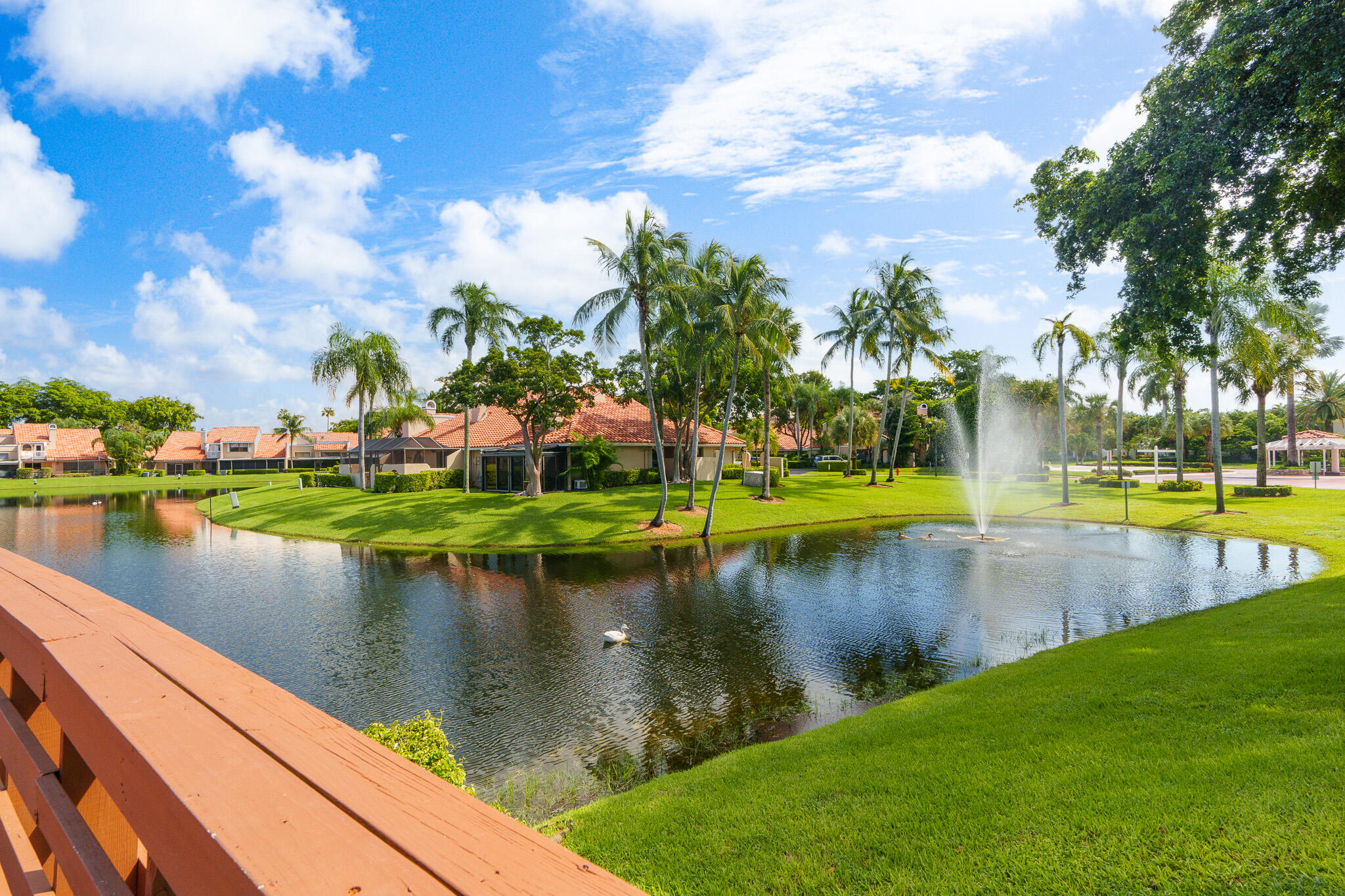 22545 Meridiana Drive Boca Raton, FL 33433 - Photo 46 of 63 a view of a lake with houses in the background