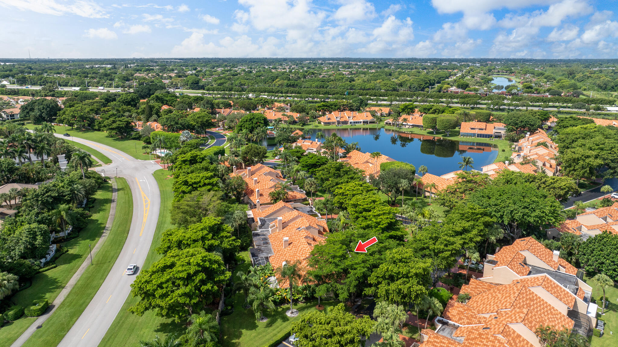 22545 Meridiana Drive Boca Raton, FL 33433 - Photo 52 of 63 an aerial view of a houses with a lake view