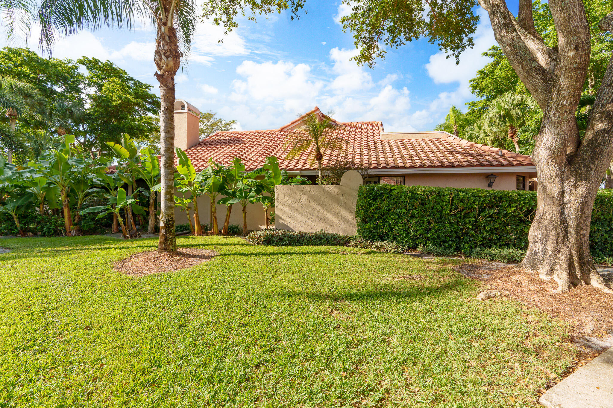 22545 Meridiana Drive Boca Raton, FL 33433 - Photo 55 of 63 a view of a big house with a big yard and palm trees