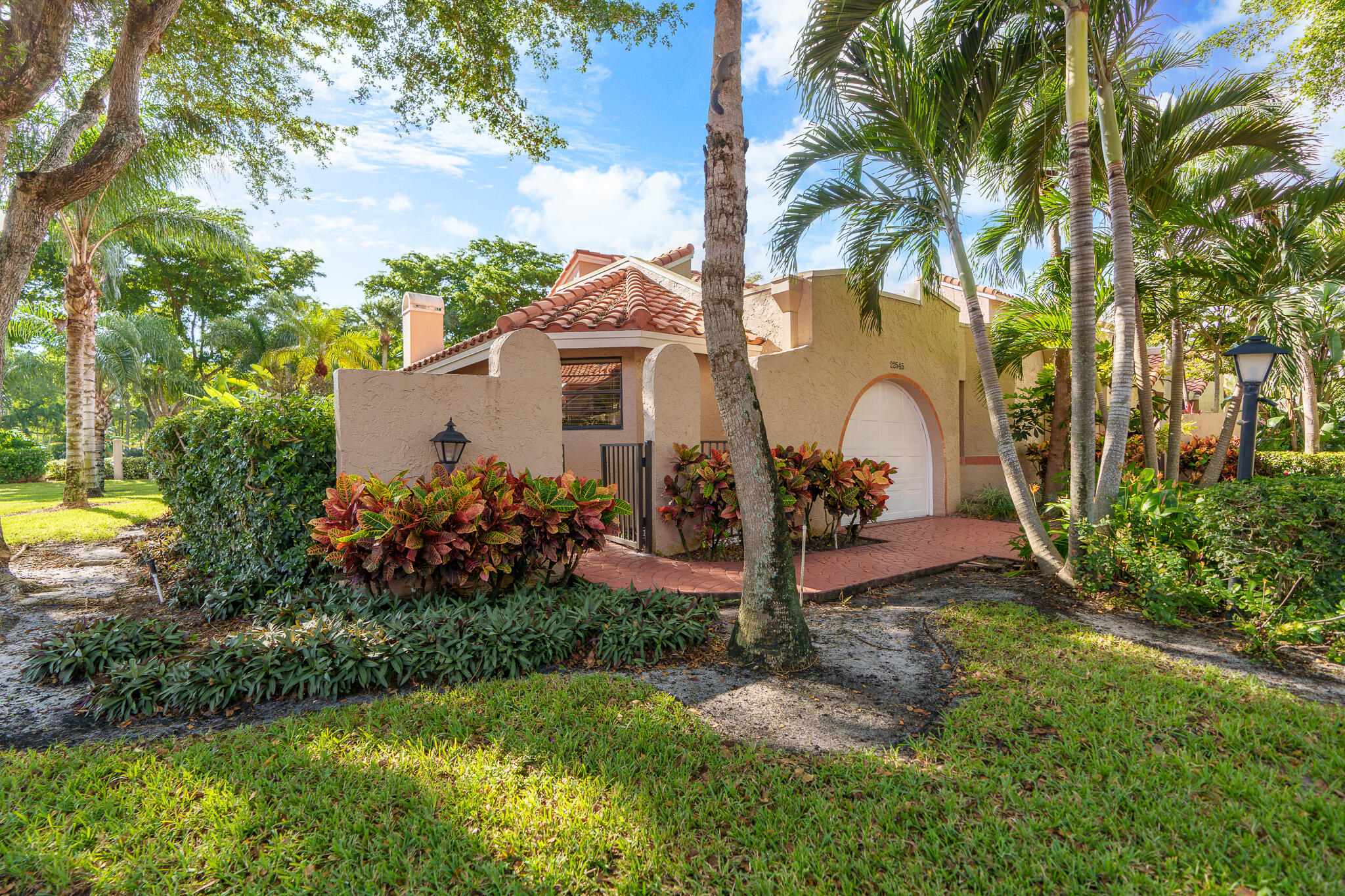 22545 Meridiana Drive Boca Raton, FL 33433 - Photo 57 of 63 a front view of a house with garden
