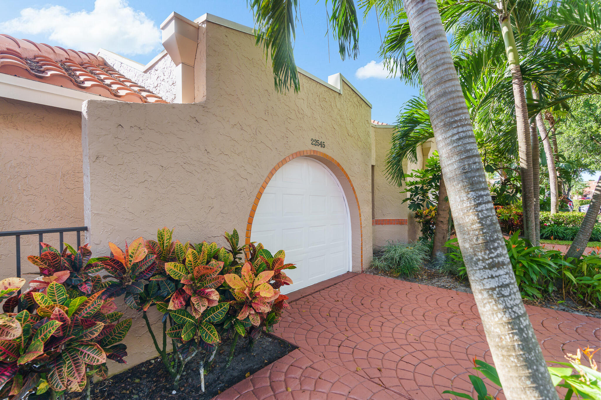 22545 Meridiana Drive Boca Raton, FL 33433 - Photo 58 of 63 a front view of a house with a yard