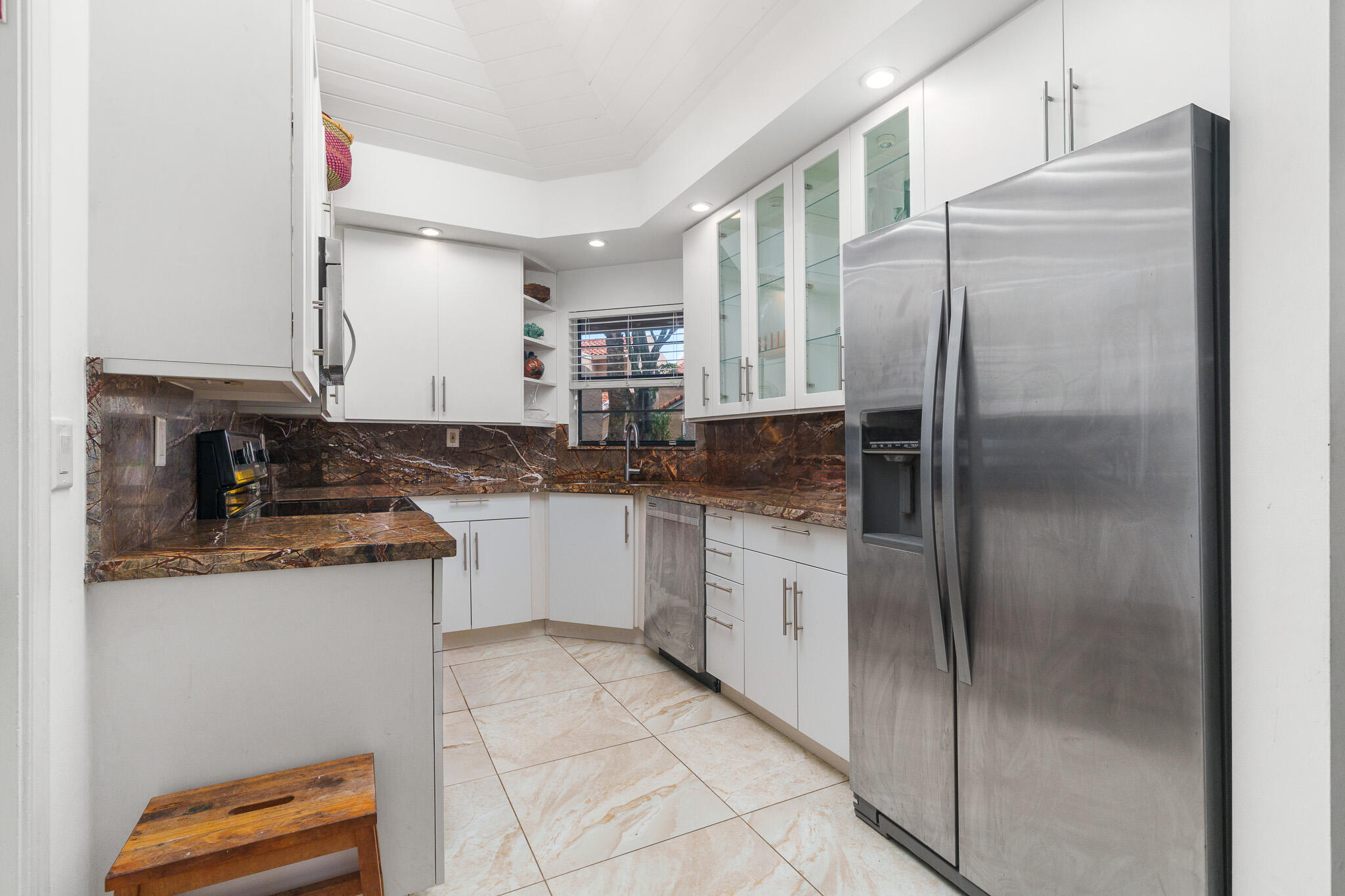 22545 Meridiana Drive Boca Raton, FL 33433 - Photo 8 of 63 a kitchen with stainless steel appliances granite countertop a refrigerator and a sink