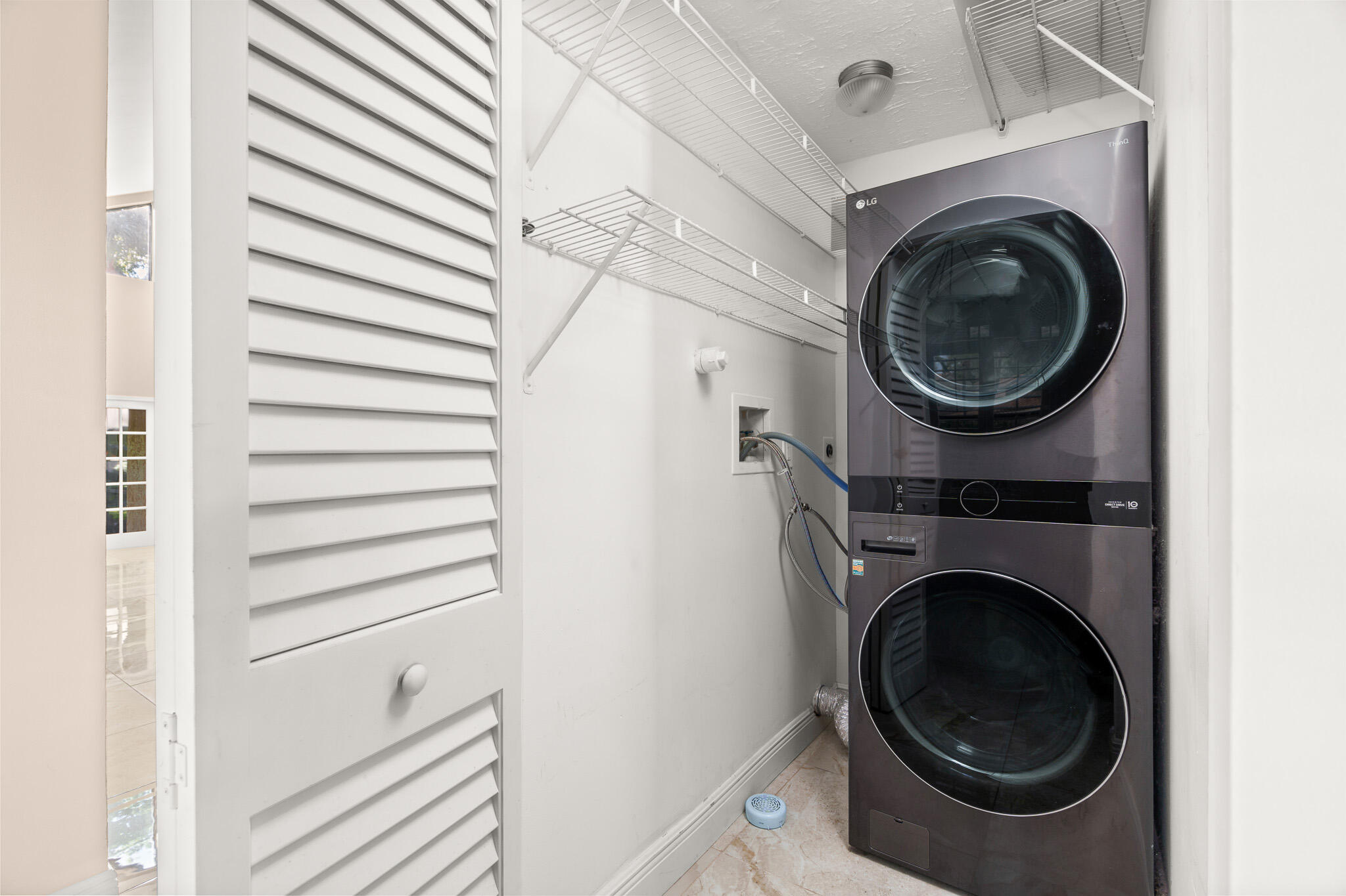 22545 Meridiana Drive Boca Raton, FL 33433 - Photo 10 of 63 a utility room with dryer and washer