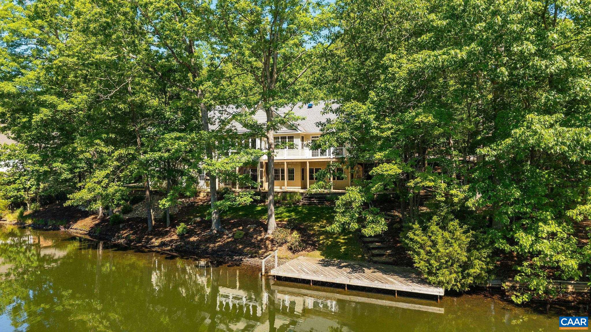21 Amethyst Road Palmyra, VA 22963 - Photo 2 of 66 a view of a lake with a house in the background