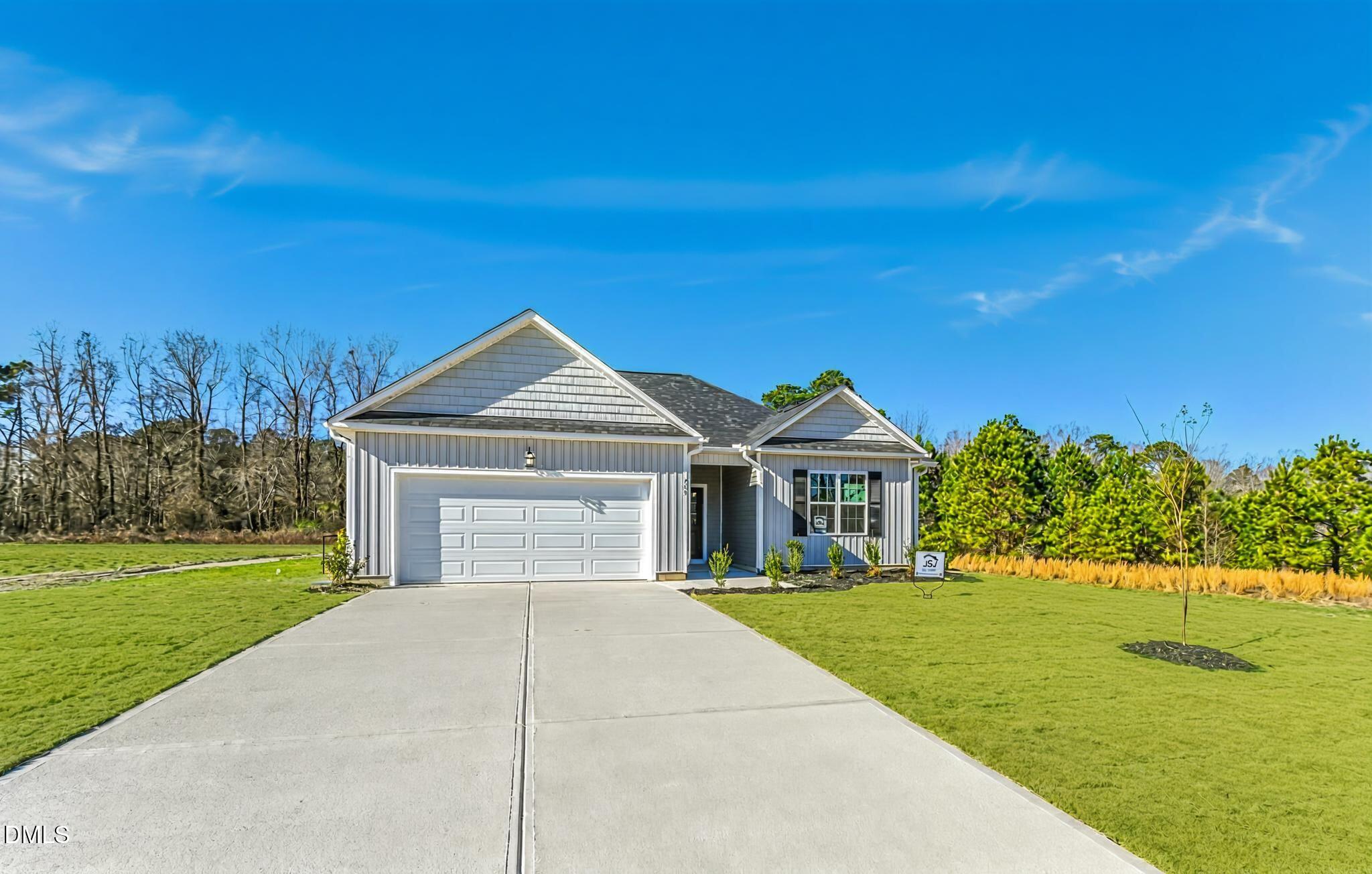 205 Hookbill Lane Lillington, NC 27546 - Photo 2 of 36 a front view of a house with a yard