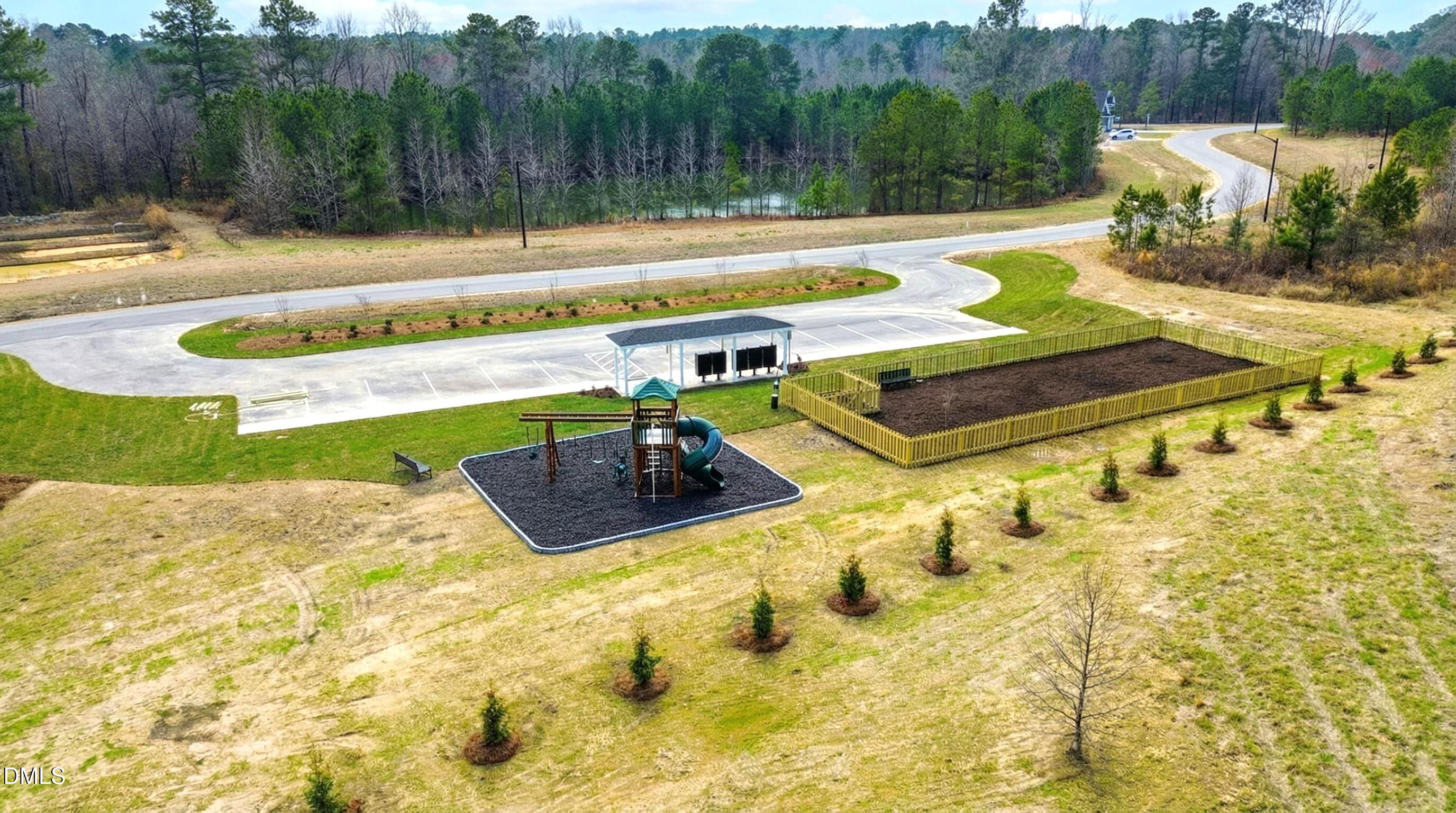 205 Hookbill Lane Lillington, NC 27546 - Photo 36 of 36 a view of a swimming pool with a yard