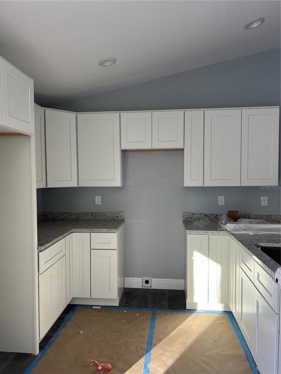 20050 Southwest 80th Pl Road Dunnellon, FL 34431 - Photo 2 of 10 a kitchen with a sink and cabinets