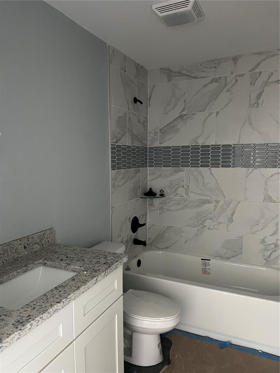 20050 Southwest 80th Pl Road Dunnellon, FL 34431 - Photo 6 of 10 a bathroom with a granite countertop sink toilet and shower