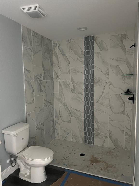 20050 Southwest 80th Pl Road Dunnellon, FL 34431 - Photo 8 of 10 a bathroom with a toilet and shower