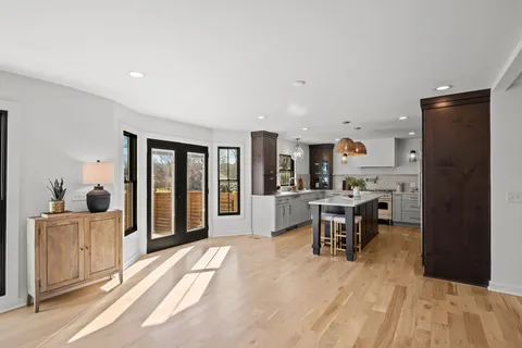 a kitchen with cabinets a sink and stainless steel appliances