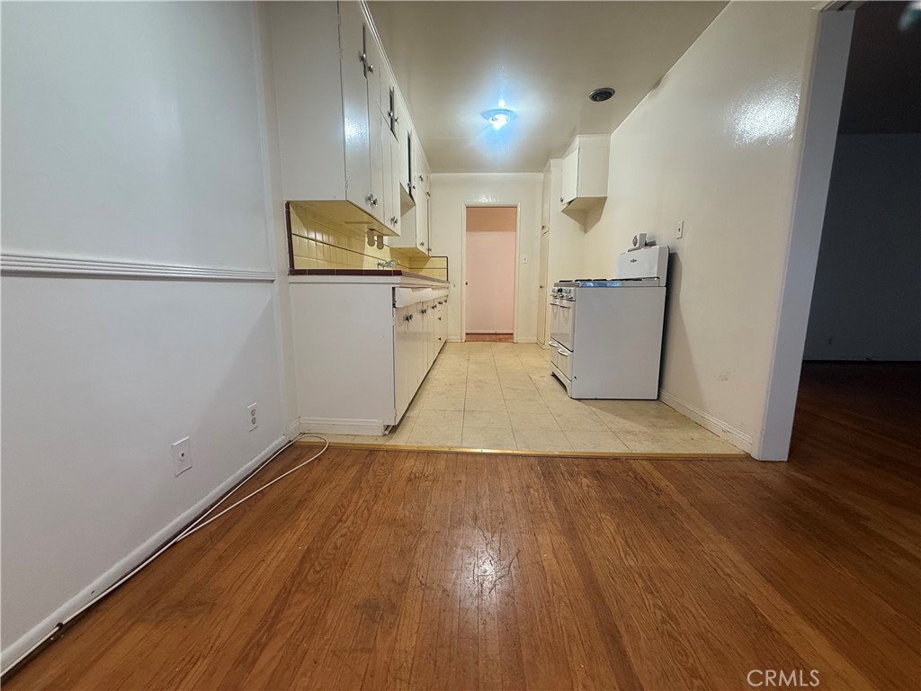 50 Elm Avenue, Unit 11 Long Beach, CA 90802 - Photo 11 of 15 a view of a storage & utility room with wooden floor