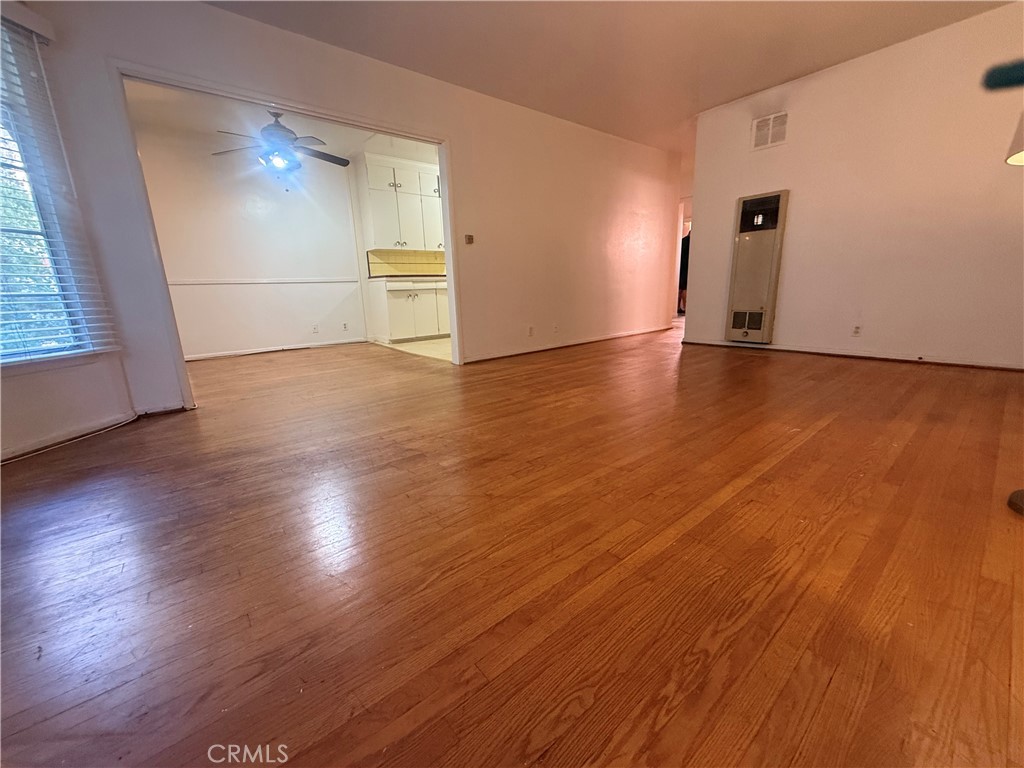 50 Elm Avenue, Unit 11 Long Beach, CA 90802 - Photo 6 of 15 an empty room with wooden floor and windows