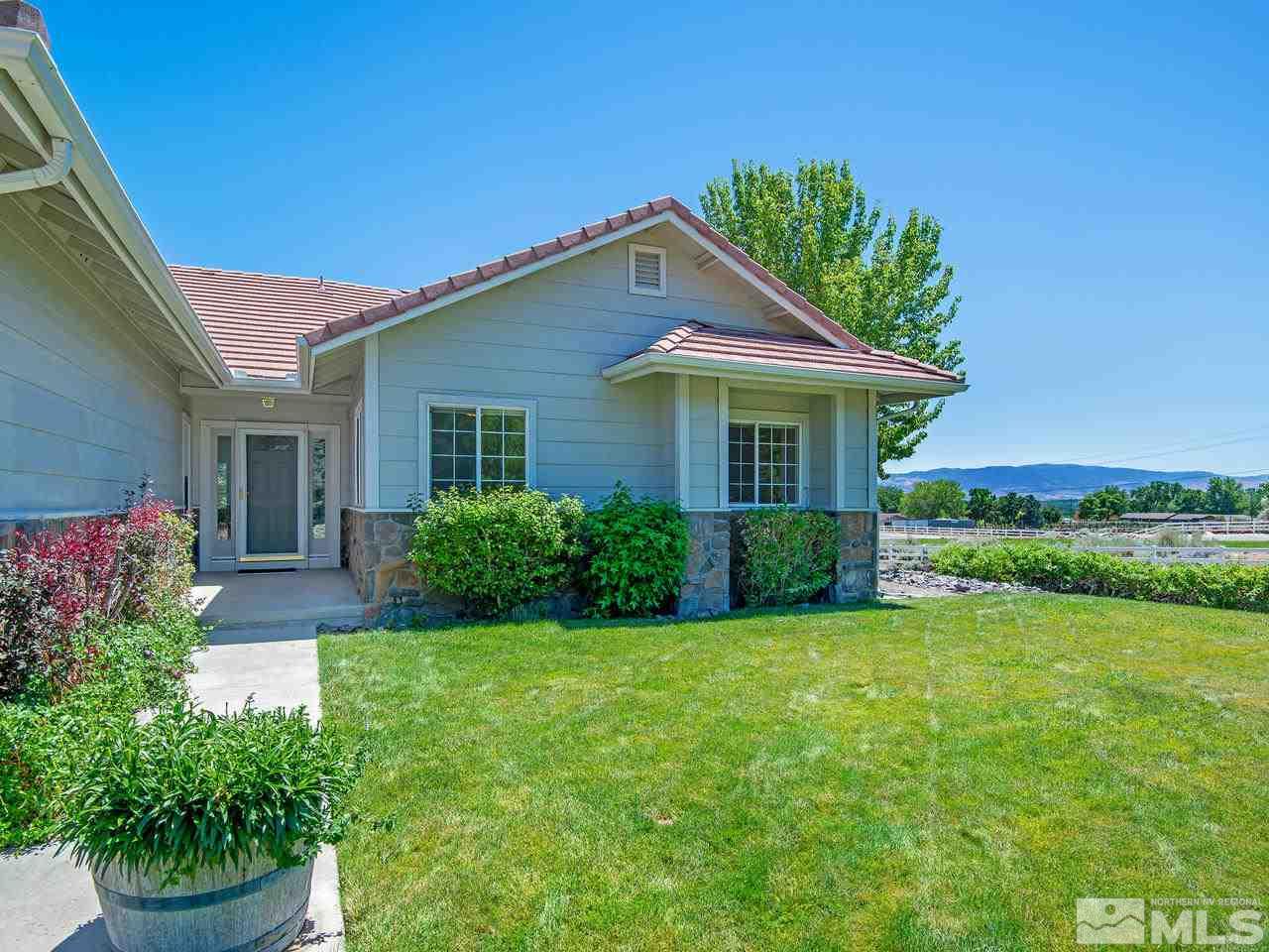 6550 Fieldbrook Circle Reno, NV 89519 - Photo 3 of 21 a view of a house with a yard and potted plants