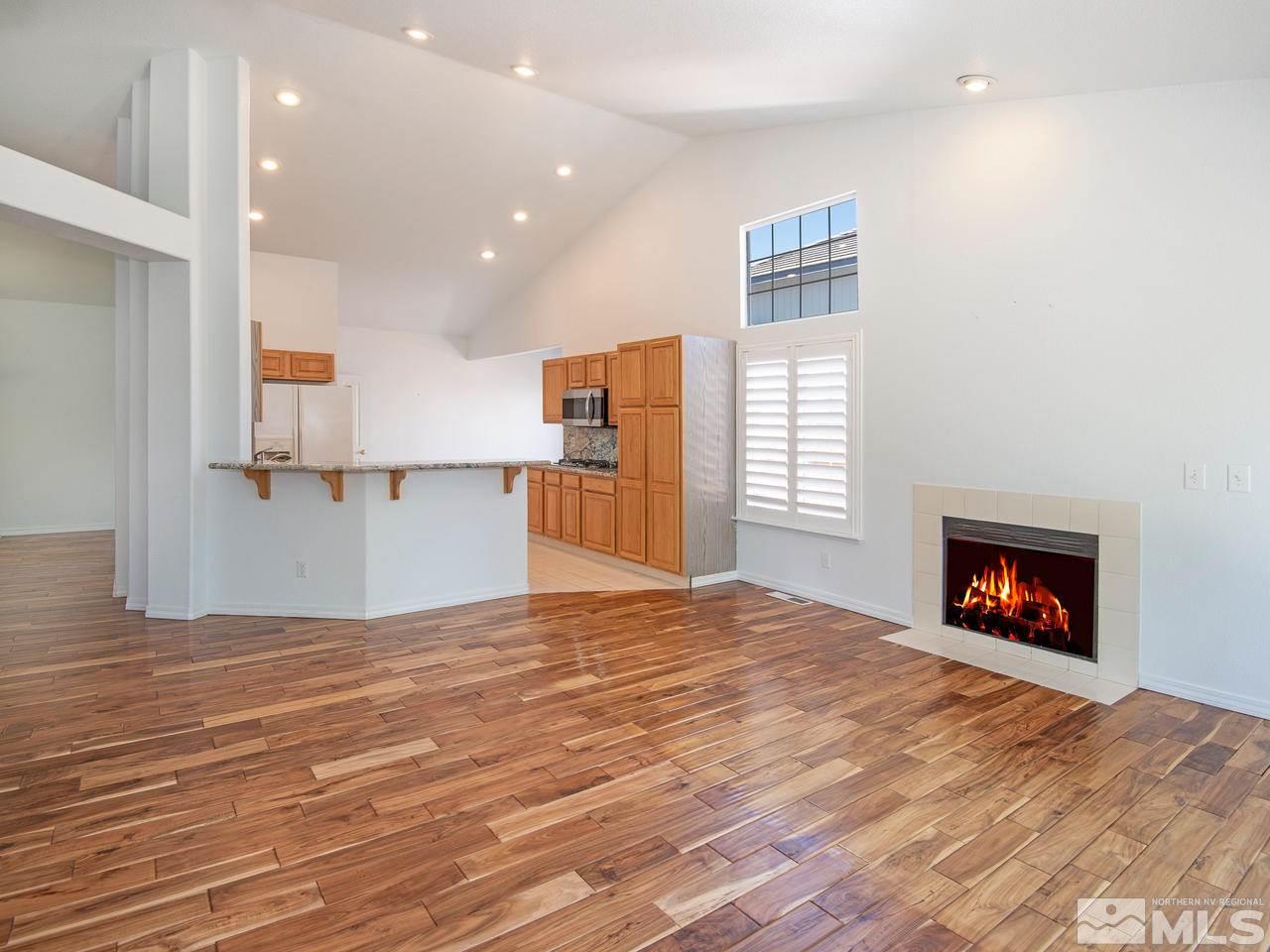 6550 Fieldbrook Circle Reno, NV 89519 - Photo 4 of 21 a view of a kitchen and an empty room with a fireplace