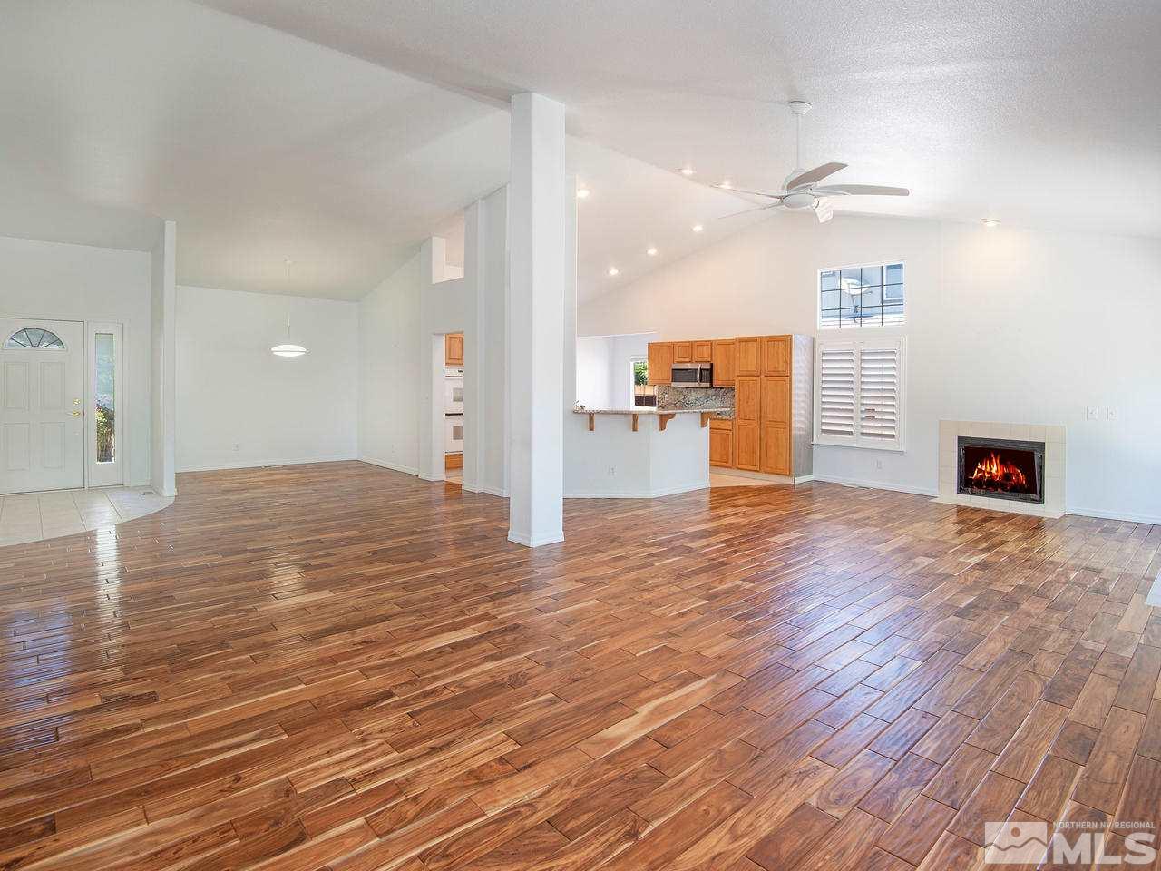6550 Fieldbrook Circle Reno, NV 89519 - Photo 8 of 21 a view of a kitchen with wooden floor and a refrigerator