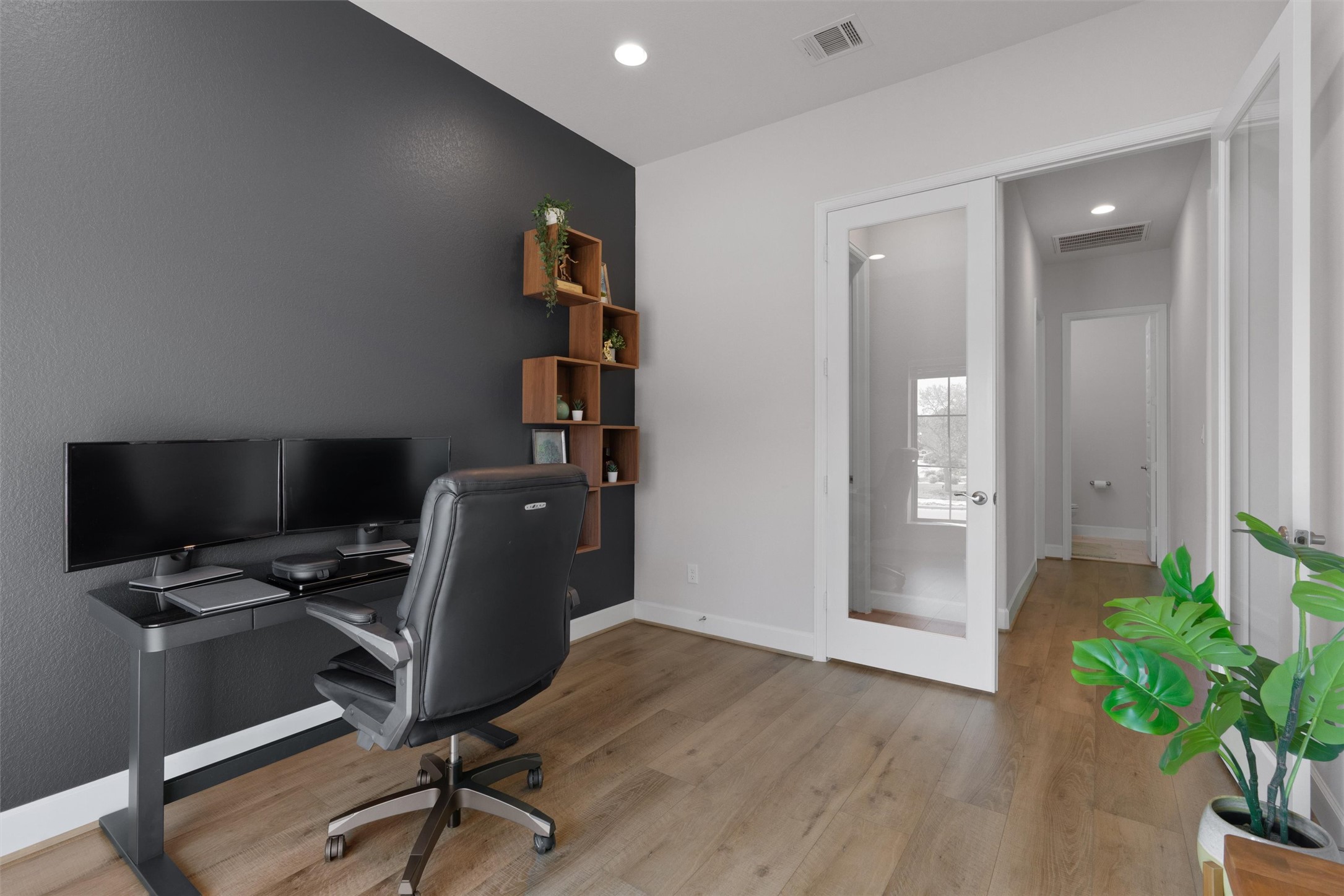 101 Pienza Drive Georgetown, TX 78628 - Photo 24 of 40 a view of a workspace with furniture and a window